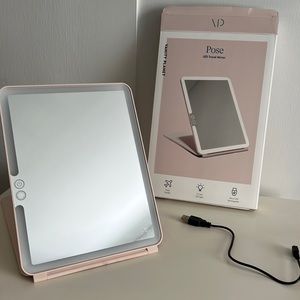 Vanity Planet Pose LED travel mirror.